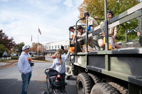 Members of Clarkesville Boy Scouts Troop 5 (right) give candy to the English family (left). ZACH TAYLOR/Special
