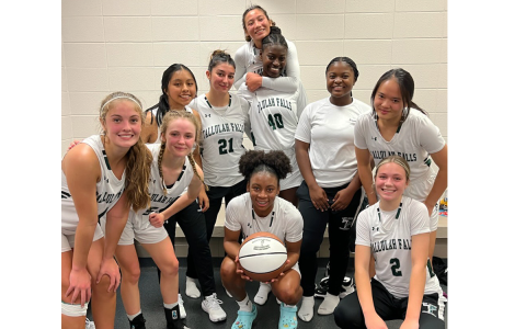 Tallulah Falls’ Denika Lightbourne (with ball) celebrates with teammates after scoring her 1,000th point in a TFS win. AUSTIN POFFENBERGER/Special