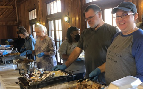From the left, Lou Ann Duckett, Taymonia Jackson, Shane Adams and Shanna Adams serve a Thanksgiving meal at a previous Community Thanksgiving Dinner. SUBMITTED