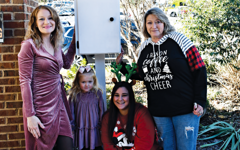 Marilon Lostin, and daughter Monroe Lewallen display their first pantry at Habersham County Senior Center with Kayla Ellis and Kathy Holcomb. JOHN DILLS/Staff