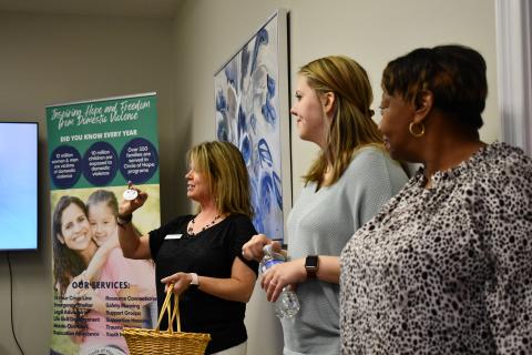 Linda Shadburn, alongside volunteers Chelsea Thomas and Gwen Wiley, presents a Circle of Hope volunteer button as a symbol of recognition for all the work their volunteers do. FILE