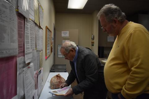 Meals on Wheels volunteers Bill Gaik and Martin May prepare for their route before hitting the road. EMMA MARTI/Staff