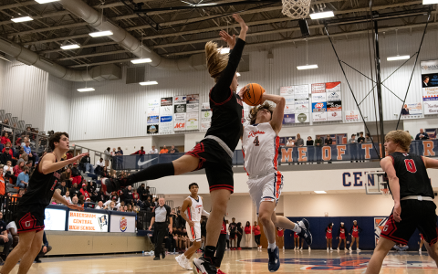 Habersham Central’s point guard Brannon Gaines drives hard to the basket against a  Gainesville defender to keep the Raiders close in Friday night’s game. ZACH TAYLOR/Staff