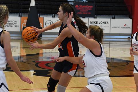 Habersham Central's Kyia Barrett dishes to a teammate during the Battle of the Borders tournament.