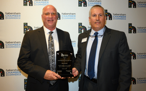 Habersham Countian of the Year for 2022 Brent Edwards (left) is presented his award by Habersham EMC President Bryan Ferguson at Thursday’s Chamber of Commerce dinner. ZACH TAYLOR/Special