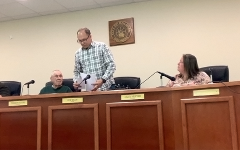 Baldwin Mayor Joe Elam gathers his papers just before leaving his post for good Tuesday night. SUBMITTED