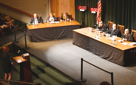 Tallulah Falls student Josie Chesser (left) asks Judges Stephen Dillard, Brian Rickman, and Trea Pipkin a question after the court’s case on Tuesday. JOHN DILLS/Staff
