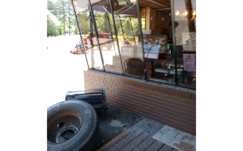 The front window of Cowboy Bob’s was broken by a stray truck tire from an accident Monday afternoon. PAULA KUBINCHAK/Submitted