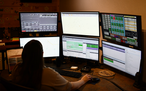 Habersham County 911 dispatcher Belinda Konarski checks out her many computer screens between phone calls. JOHN DILLS/Staff