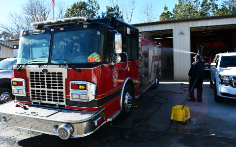 Habersham County firefighter David Thompson washes down one of the trucks at Firehouse 12 earlier this year. Habersham County took a second shot at the SAFER grant to add much-needed fire personnel, this time using grant writer Lauren Long instead of a third-party contractor that did not win the grant last year. JOHN DILLS/Staff