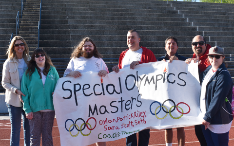 Shown are (from left) Masters Athlete Leader Tracey Clarke alongside Masters Athletes Riley Clarke, Dylan Clarke, Scott Simmons, Patrick Quillan, Seth Flores and Sara Kirschner. These athletes are graduated students who return year after year to compete in the Special Olympics. EMMA MARTI/Staff