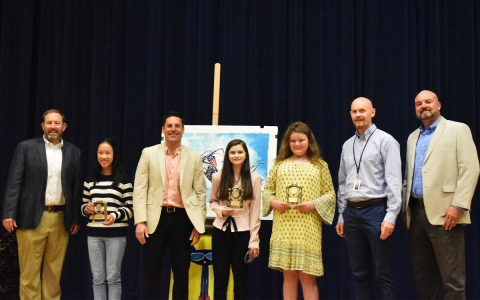 HCHS Principal Dr. Jonathan Stribling, 10th-grade winner Phoebe Warren, NGA Principal David Leenman, 9th-grade winner Kenzielynn Bodiford, 6th-grade winner Contessa Champlin, NHMS Principal Dr. Adam Bagwell and Superintendent Matthew Cooper pose together after the ceremony. EMMA MARTI/Staff