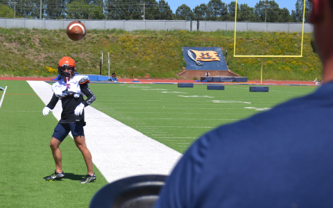 Habersham  Central’s Zeke Whittington gives the jug machine a test on the first day of spring practice. MATTHEW OSBORNE/Staff