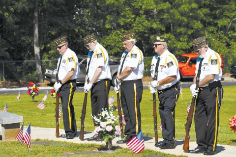 Grant-Reeves Honor Guard members (from left) Rob Wallace, Roy Albea, Barry Church, Ronnie Dotson and Bob Trousdale bow their heads while listening to the Memorial Day remarks Monday morning, MATTHEW OSBORNE/Staff