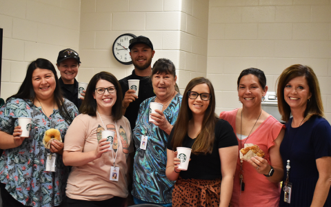 Shown enjoying the treats at Demorest Elementary are teachers and employees of the school including (front row, from left) Marisela Hernandez, Keylia Patton, Deborah Payne, Ashley Wilson, Meghann Holbrook and Amy Butterworth. Back row are School Resource Officers Victoria Hopper and Caleb Tyler. EMMA MARTI/Staff