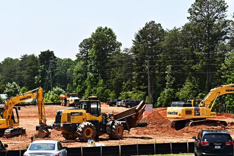 Construction vehicles prepare the land for the future Cornelia Marriott across the street from the current Hampton Inn.
