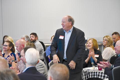 Past United Way President Bob Cook gets a round of applause and appreciation at Thursday’s breakfast at North Technical College.