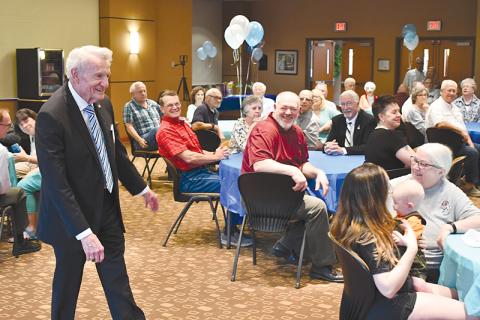 Larry Whitfield (left) can hardly believe so many folks showed up just to celebrate his birthday. The community icon turned 80 on  May 17.