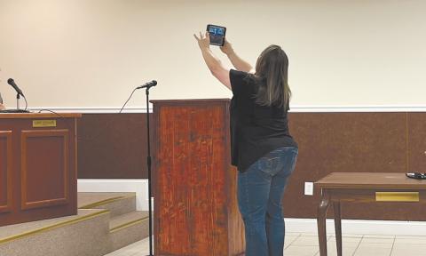 Mayor Alice Venter shows the Facebook livestream viewers the lack of participants in Friday’s meeting focused on the public hearing of the fiscal year 2024 budget. JOHN DILLS/Staff