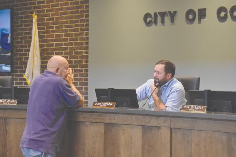 Longtime Cornelia citizen Ray Barrett shared his concerns with Mayor John Borrow (right) and the city commissioners on various issues.