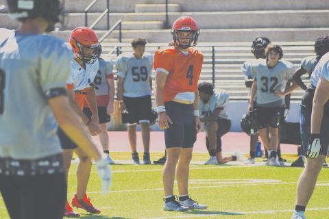 Habersham Central quarterback Carson Parker looks in for the signals during padded camp on Monday morning. LANG STOREY/Staff