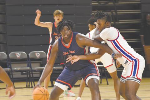 Habersham Central’s JoJo McCurry backs down his man during summer league play over the weekend. LANG STOREY/Staff