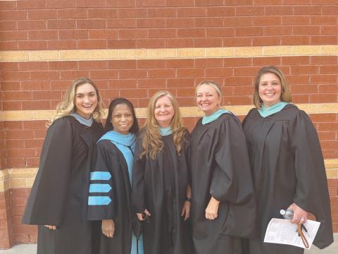 From left, Ryan Lathem, Bounemy Phongsavanh, Vickie Martin, Debra Franklin and Natalie Ziemba, all of the Habersham Success Academy, were all smiles before the Class of 2023 graduated in May. SUBMITTED