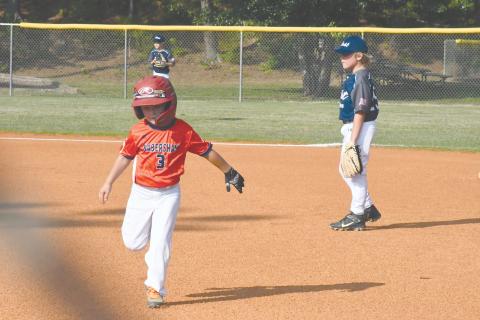 Habersham's Tobias Chastain runs back to first during the 8-U recreation tournament.