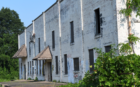 The abandoned building in the City of Baldwin has been vandalized with graffiti and now sits condemned by the city due to structural integrity. JOHN DILLS/Staff