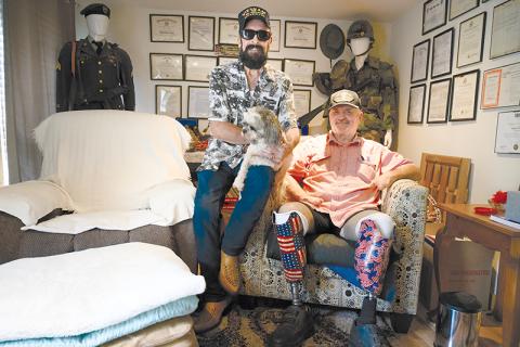 Vietnam veterans Charlie Mack Booth and Ray Bowen sit in the den at Charlie’s house, which features a plethora of military memorabilia dating back to World War II. ZACH TAYLOR/Special