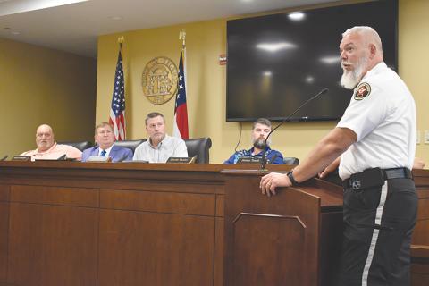 Sheriff Joey Terrell (right) told the county commissioners Monday that he means business when it comes to making Highway 365 safer.