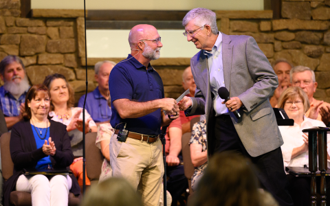 Dr. Craig Ward accepts a small token of appreciation from Bob Williamson for his 10 years of service at Bethlehem Baptist Church. ZACH TAYLOR/Staff