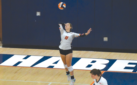 Habersham Central’s Jayden Jarrett serves during an earlier home match. LANG STOREY/Staff