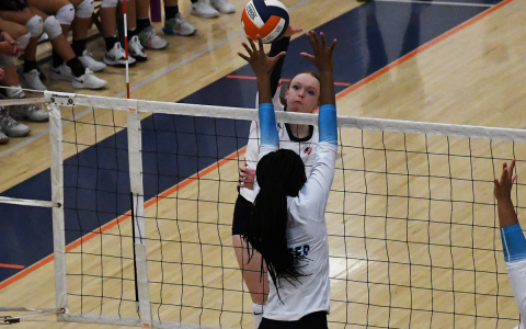 Habersham Central’s Katelynn LoBuono looks to spike the ball through the block of a Seckinger player during Thursday’s exhibition. LANG STOREY/Staff