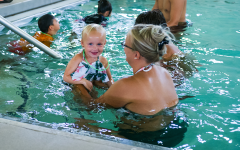 Nichole Gooch helps her daughter Rawlins practice the jellyfish floating technique and the back floating method at Saturday’s Swim Safely Day. ZACH TAYLOR/Special