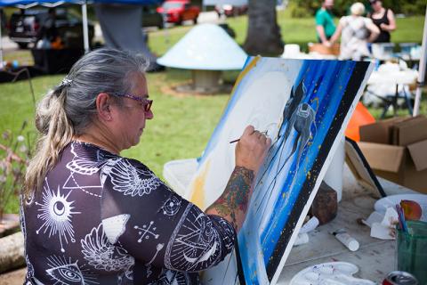 Candace Crow paints her Salvador Dali-inspired portrait of the late artist. ZACH TAYLOR/Special