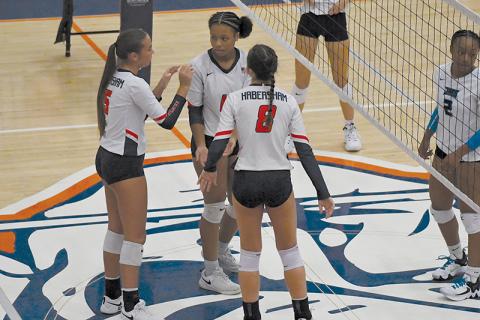 The Lady Raiders talk strategy during their preseason match last week.