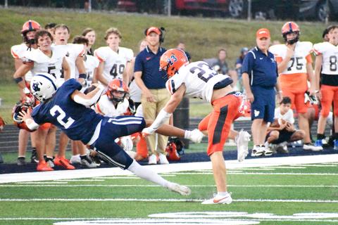Habersham Central’s Carter  Barrett (23) knocks White County  quarterback Tripp Nix (2) off his  feet during Friday night’s game. MATTHEW OSBORNE/Staff