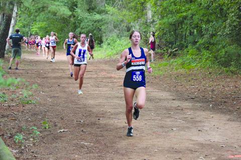 Habersham Central’s Audrey Hotard starts to pull away from the pack in the North Georgia Invitational. MARK TURNER/CNI News Service