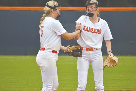 Habersham Central’s Hailee Parham (left) and Karsen Wade pump each other up before the inning begins. LANG STOREY/Staff