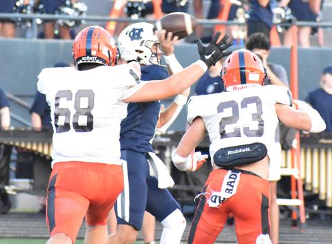 Habersham Central defenders Aidan Cianci (68) and Carter Barrett (23) chase White County quarterback Tripp Nix during the Aug. 25 game.