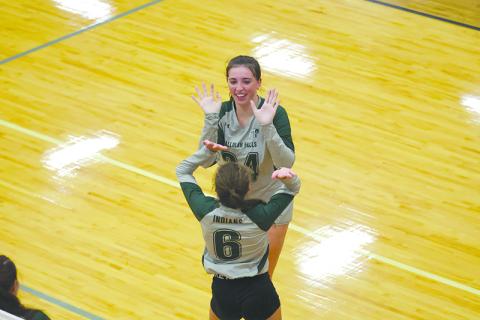 Tallulah Falls’ Addy McCoy (top) celebrates a point with teammate Julianne Shirley earlier this season. AUSTIN POFFENBERGER/Special 