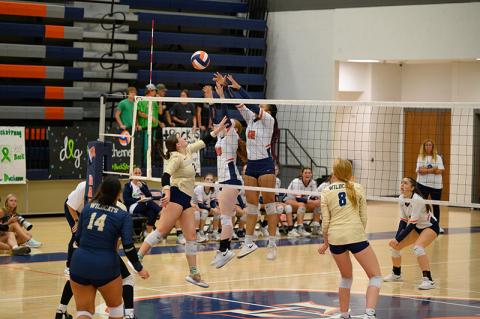 Habersham Central’s Da’Riyah Bell and Katelynn LoBuono get the block on the Apalachee attack and get the point for the Lady Raiders. ZACH TAYLOR/Special
