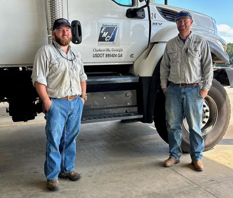 Habersham EMC linemen Jed Clark (left) and Isaac Wall prepare to depart for Guatemala. NICOLE DOVER/Submitted