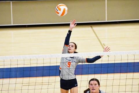 Habersham Central’s Maci Williams gets up high to play the ball during a recent home match. LANG STOREY/Staff