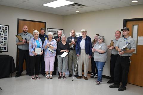 Rabun County First Responders were recognized for their lifesaving efforts when Daniel “Jack” Smith suffered a stroke in June, during a special ceremony at the Rabun County Senior Center last month. Pictured are Logan Carnes; Beverly Mason; Justin Upchurch; Marilyn Ballew; Mike Carnes; Jane Thomason; Gregg Dover; Daniel “Jack” Smith; Katie Coalley; Kenette Turner; Jonathan Watts; and Tate Nichols. MEGAN HORN/The Clayton Tribune