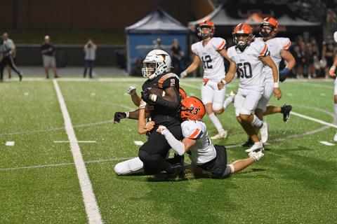 Habersham Central’s Carter Barrett brings down Lanier’s Tayo Ashadele last Friday. TOM ASKEW/Special