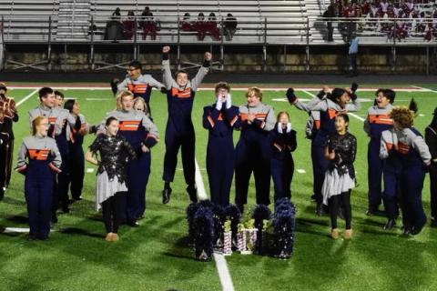 The Band of Blue celebrates their achievement. Submitted