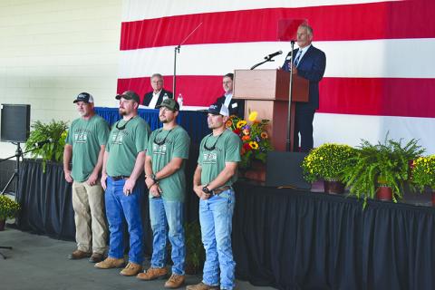 Habersham EMC and CEO Bryan Ferguson (on stage) recognized its lineman who were champions of last year’s International Lineman’s Rodeo, including coach Chris Chapman, Tucker Dyer, Robert Morris and Dillon Welborn. MATTHEW OSBORNE/Staff