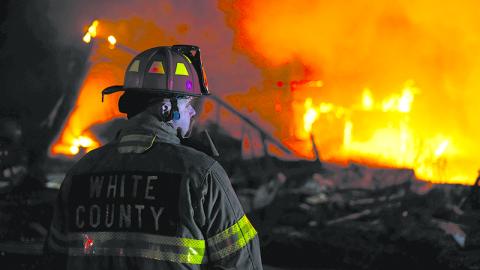 Shift Captain Jody Holland monitors the residential fire. WHITE COUNTY/Submitted